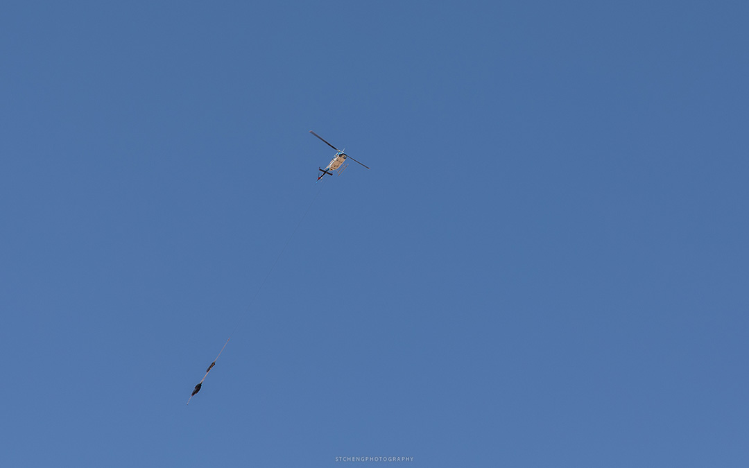 Helicopter Dragging a Bag of Supplies